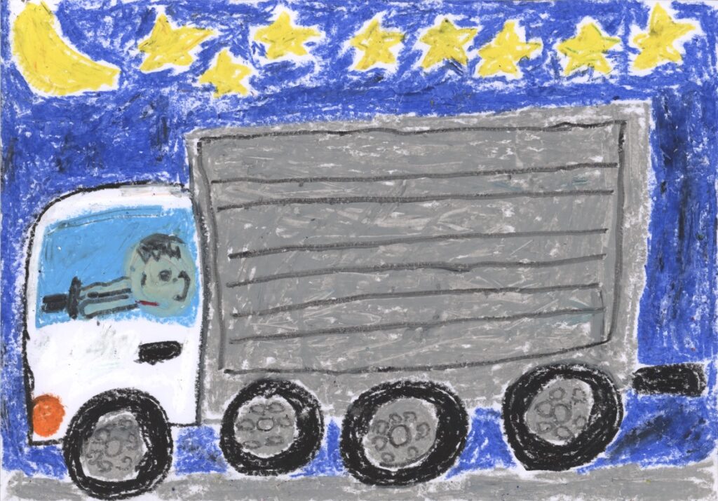 夜の街を走る大型トラック