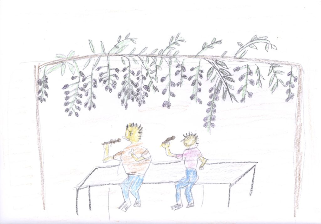 藤棚の下でダンゴ食べる親子